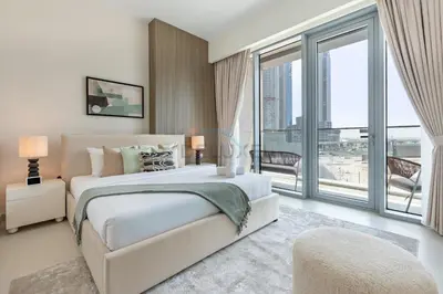 a bedroom with a large bed and a large window at Spacious 3BR Living, Walking Distance to Dubai Water Canal and Park, Near Safa Park Marine Transport Station, Canal Front 9B, Al Wasl by Deluxe Holiday Homes in Dubai