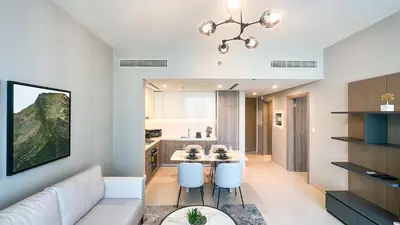 a living room with a couch and a table at Exclusive 1BR, Panoramic Marina View, Dubai Marina - 21AB02 in Dubai