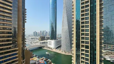 a view of a river in a city with tall buildings at Exclusive 1BR, Panoramic Marina View, Dubai Marina - 21AB02 in Dubai