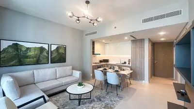 a living room with a couch and a table at Exclusive 1BR, Panoramic Marina View, Dubai Marina - 21AB02 in Dubai