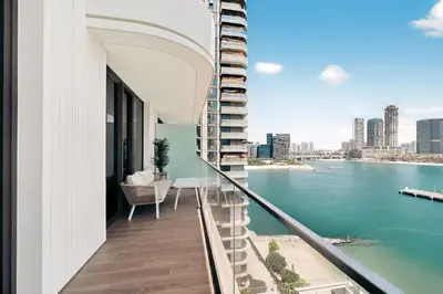 a balcony with a view of the water at Beachfront Luxury 2BR with Breathtaking Views in Dubai