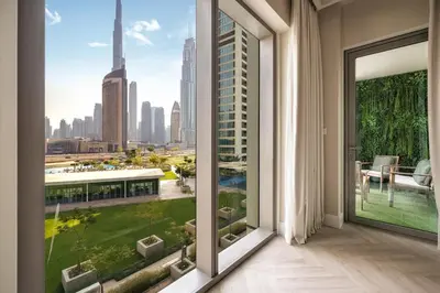 a room with a large window with a view of the city at 2BR Gem with Burj Khalifa View and Dubai Mall Access in Dubai