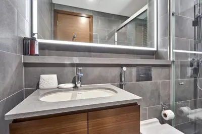 a bathroom with a sink and a mirror at STAY BY LATINEM Luxury 1BR Holiday Home CB 1210 Near Burj Khalifa in Dubai
