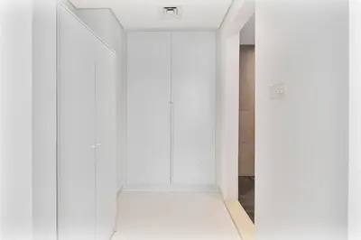 an empty room with white walls and white doors at Elegant Studio in Business Bay near Burj Khalifa in Dubai