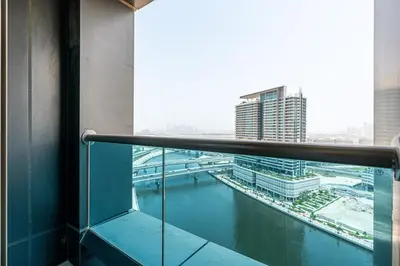 a view of a river from a balcony in a building at Elegant Studio in Business Bay near Burj Khalifa in Dubai