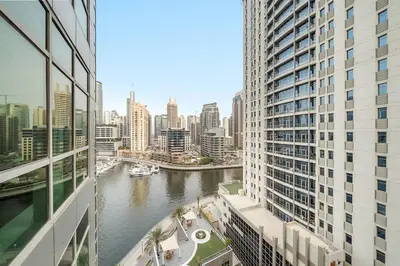 a view of a river in a city with buildings at Stylish 1BR in Dubai Marina with Balcony, Pool & Walk to Beach in Dubai