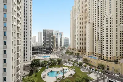 an aerial view of a city with tall buildings at Stylish 1BR in Dubai Marina with Balcony, Pool & Walk to Beach in Dubai