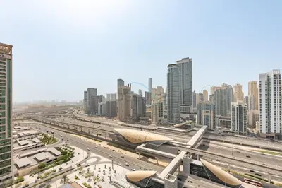 a view of a city with tall buildings at Chic Waterfront Location with Direct Metro Access and a Glimpse of Ain Dubai, Lake City Tower, Jumeirah Lake Towers by Deluxe Holiday Homes in Dubai