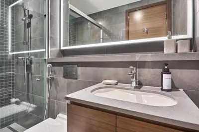 a bathroom with a sink and a shower at STAY BY LATINEM Luxury 1BR Holiday Home CB 1807 Near Downtown in Dubai