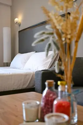 a bedroom with a bed and a wooden table with a tableasteryasteryasteryastery at Luxury Studio Near Downtown Dubai in Dubai