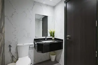 a bathroom with a toilet and a sink with a mirror at Luxury Studio Near Downtown Dubai in Dubai