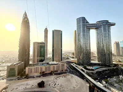 a view of a city with many tall buildings at Charming 1 BR with Balcony Retreat in Dubai