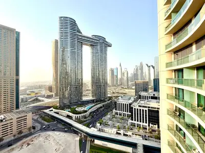 an aerial view of a city with tall buildings at Charming 1 BR with Balcony Retreat in Dubai