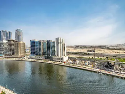a view of a city with a river and buildings at Livin' Holidays - Studio - Bay View with Jacuzzi in Dubai