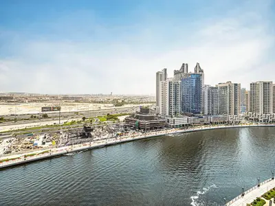 a view of a city with a river and buildings at Livin' Holidays - Studio - Bay View with Jacuzzi in Dubai