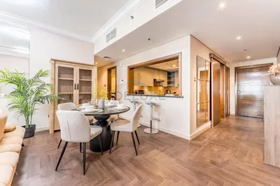 a dining room and kitchen with a table and chairs at Apartment near Burj Khalifa and Dubai Mall, Central Location, Minutes to Dubai Marina and Palm Jumeirah - 8 BLVD Walk, Downtown Dubai by Deluxe Holiday Homes in Dubai