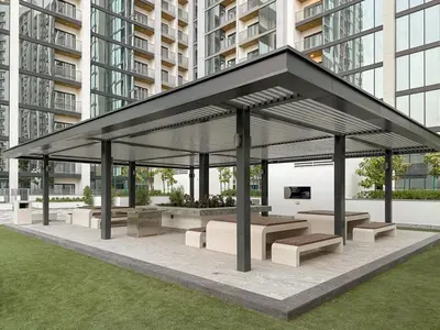 a pavilion with benches and tables in a city at FIRST CLASS 4BR Sobha Skyline Luxury in Dubai