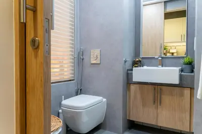a bathroom with a toilet and a sink at Scent of the Palms by Lagom in Dubai