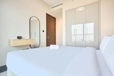 a bedroom with a mirror and a bed at STAY BY LATINEM Luxury 1BR Holiday Home CB 1409 Near Burj Khalifa in Dubai