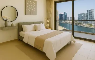 a bedroom with a large bed and a large window at Cosy 2BR Business Bay with Canal view and Swimming pool in Dubai