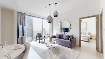 a living room with a purple couch and a mirror at Vacationer l Urban Luxe 1 Bedroom l with Marina Views in Dubai
