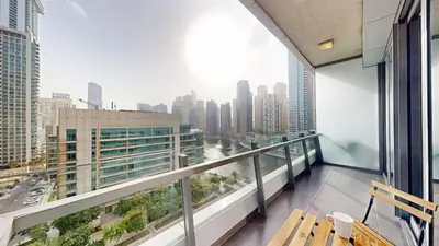 a balcony with a view of a city at Vacationer l Bright 1 Bedroom l near Marina Promenade in Dubai