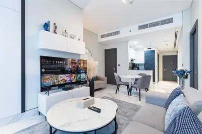 a living room with a couch and a table at Contemporary Business Bay 1-Bed with City Views in Dubai