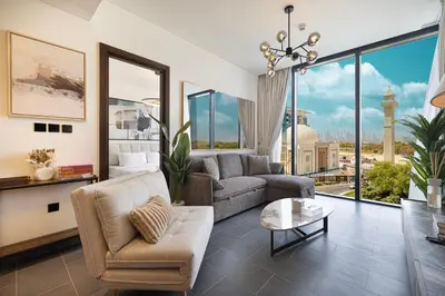 a living room with a couch and a table at Moon Stays - Opulent 2BR Stay - Sobha Hartland in Dubai
