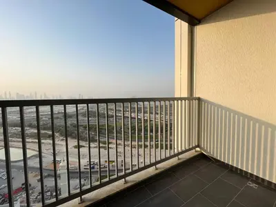 a balcony with a view of a city at The Crest Sobha Hartland in Dubai