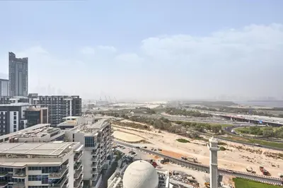 a view of a city with a beach and buildings at STAY BY LATINEM Luxury 1BR Holiday Home CB1508 Near Burj Khalifa in Dubai