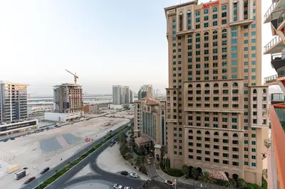 an aerial view of a city with tall buildings at Cosy 2 Bed Apartment in Al Jaddaf in Dubai