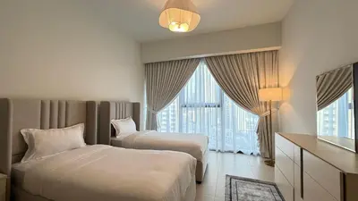 a hotel room with two beds and a window at Premium 2bed Apartment In Downtown Act1 Tower in Dubai