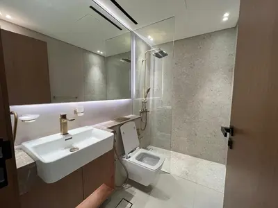a bathroom with a sink and a toilet at Binghatti Lavender in Dubai