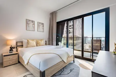 a bedroom with a large bed and a large window at Trendy 1BR with a Glimpse of Burj Khalifa, Near Zabeel Stadium, Minutes Drive to Dubai Frame, Binghatti Creek, Al Jaddaf by Deluxe Holiday Homes in Dubai