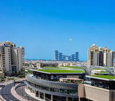a view of a city with tall buildings at Palm Jumeirah, panoramic free pool,beach in Dubai
