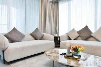 a living room with two couches and a coffee table at Executive 2-Bedroom Apartment in Downtown views 2 with access to Dubai mall in Dubai