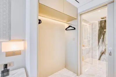 a bathroom with a shower and a glass door at PVH - Emaar Residence Fashion Avenue - Burj Khalifa View Studio in Dubai