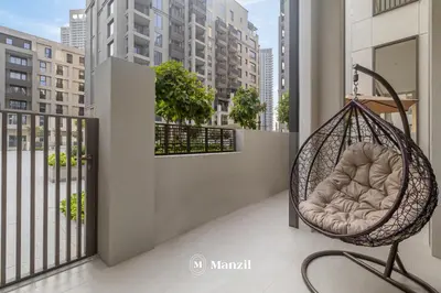 a swing on the balcony of a building at Waterfront 1BR Apartment in Creek Harbour near Downtown in Dubai