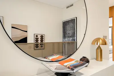 a room with a mirror and a chair at FIRST CLASS VILLA Hidden Luxury Gem in Dubai
