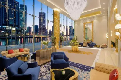 a hotel lobby with a view of the city at Spacious 1BR with Balcony and Pool Access in Dubai