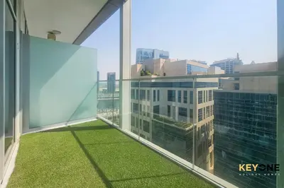 a balcony with a view of a city at Majestine Living Stylish Studio with Canal View in Dubai