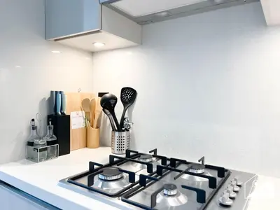 a kitchen counter with a stove top in a kitchen at Luxury 1-Bed in Meydan with Balcony & City Views in Dubai