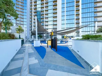 a view of a walkway in a city with buildings at Modern 1B Luxury , Scenic City Balcony, Pool & Gym in Dubai