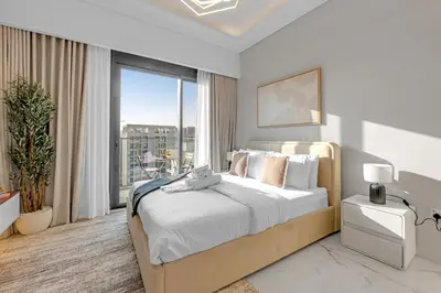 a bedroom with a large bed and a large window at Vibrant Studio Your Perfect Stay Awaits in Dubai