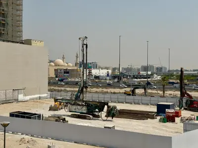 a construction site with a crane on top of a building at Golden Woods Escape Near Marina & JBR in Dubai