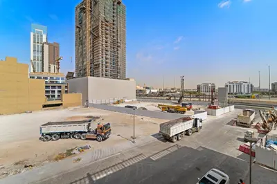 two trucks are parked in a building under construction at Golden Woods Escape Near Marina & JBR in Dubai