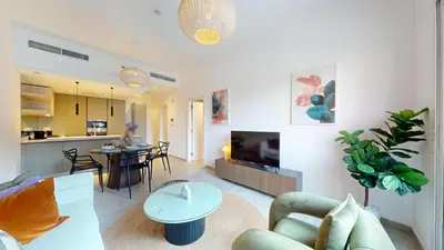 a living room with a couch and a table at Vacationer l Upgraded 1 Bedroom l near Circle Mall in Dubai