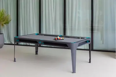 a ping pong table sitting in a room with at Royal suites LIv Marina views in Dubai