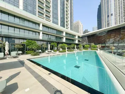 a large swimming pool in a building with tall buildings at VayK - Stunning 2BR Apt with 2 Balconies in Downtown in Dubai