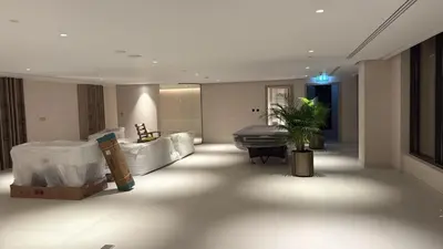 a lobby with a room with a tub and a plant at Modern Studio Apartment for Rent Fully Furnished in Dubai
